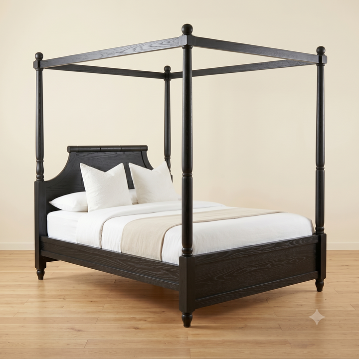 Dark wood four-poster bed with white bedding on a wooden floor.
